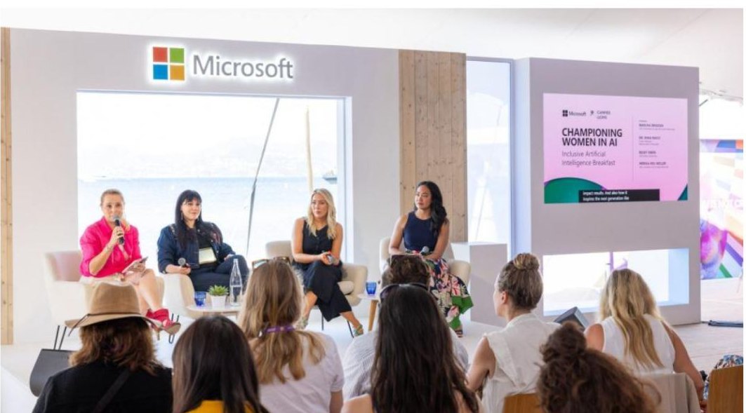 Dr. Irina Raicu second from left on a four-person panel at the Microsoft Beachhouse in Cannes, in front of a screen reading Championing Women in AI