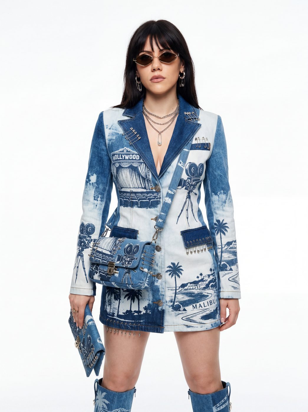 A denim jacket and mini skirt printed with a seascape, worn with denim boots