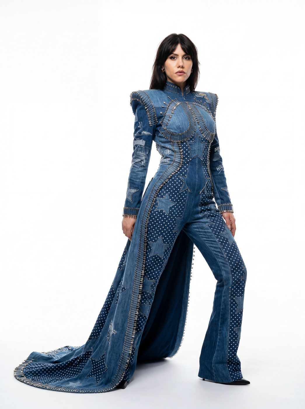 A floor-length indigo denim gown with structured shoulders and a train