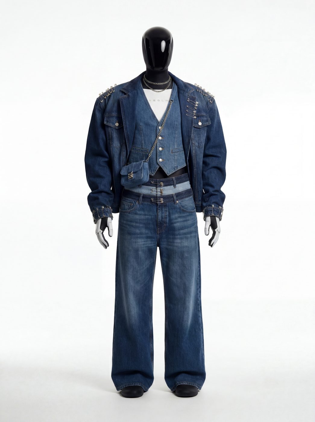An oversized denim jacket and wide jeans on a dark mannequin