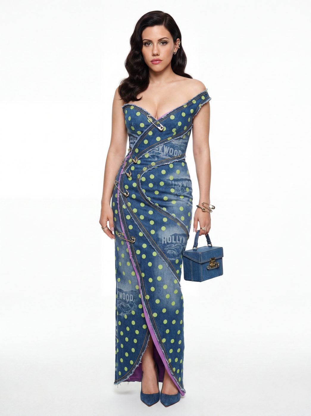 A midnight blue gown printed with small motifs, worn with a denim bag