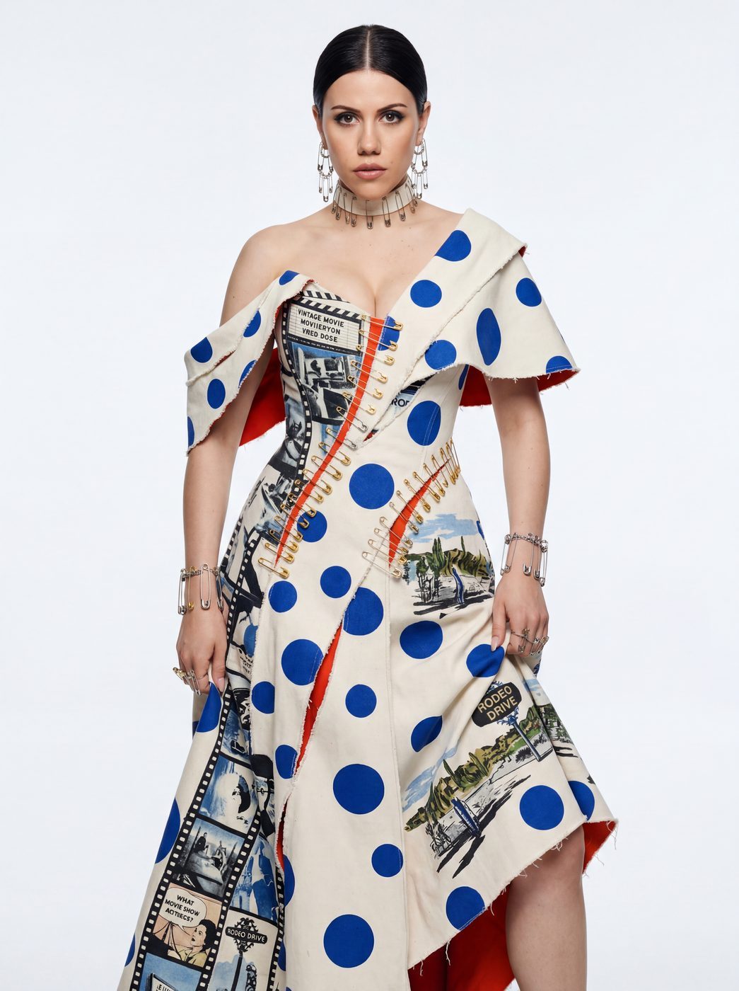 A cream asymmetric dress with cobalt dots and a printed sash