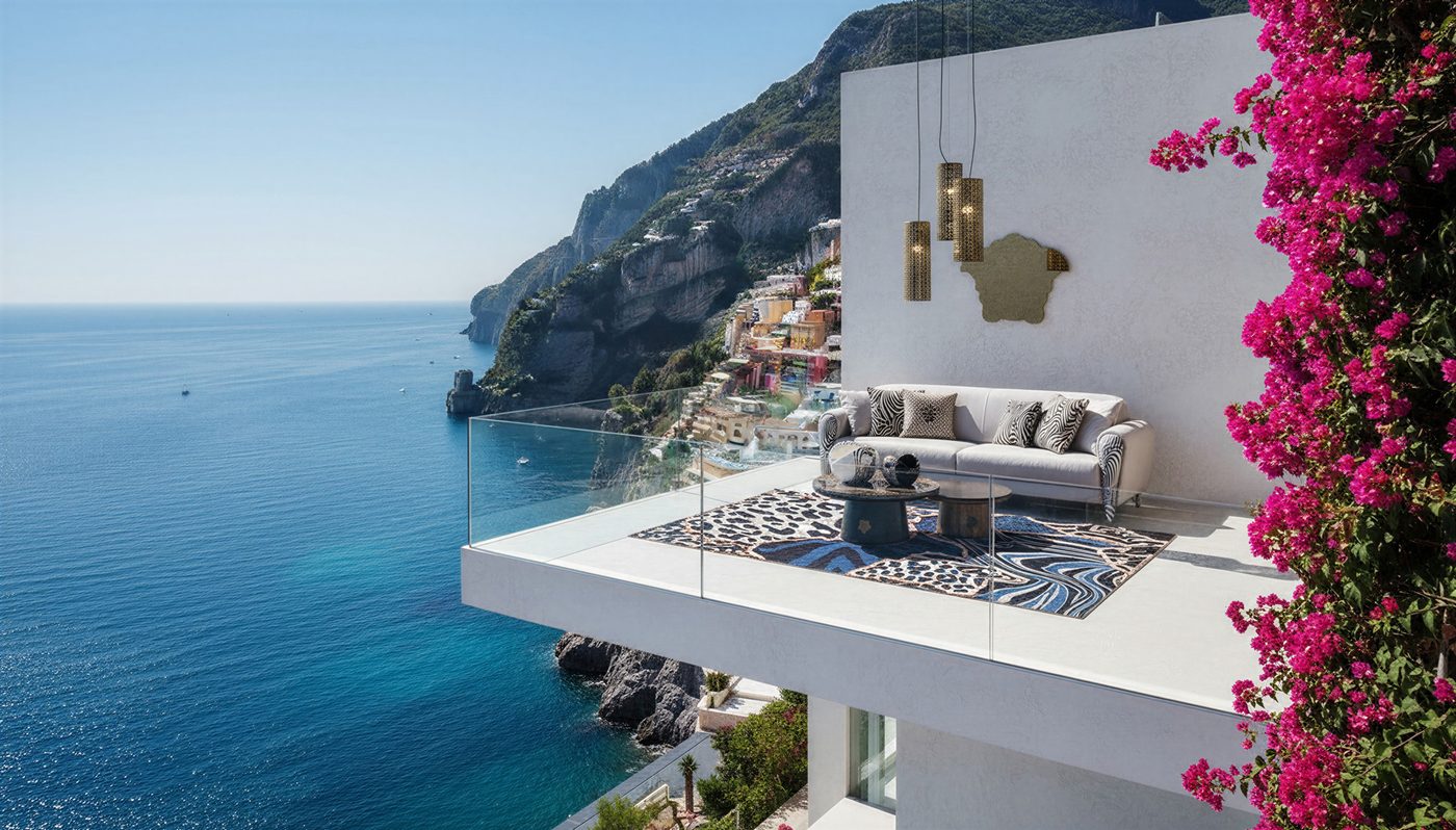 A cliffside terrace with a low sofa and bougainvillea overlooking a blue sea