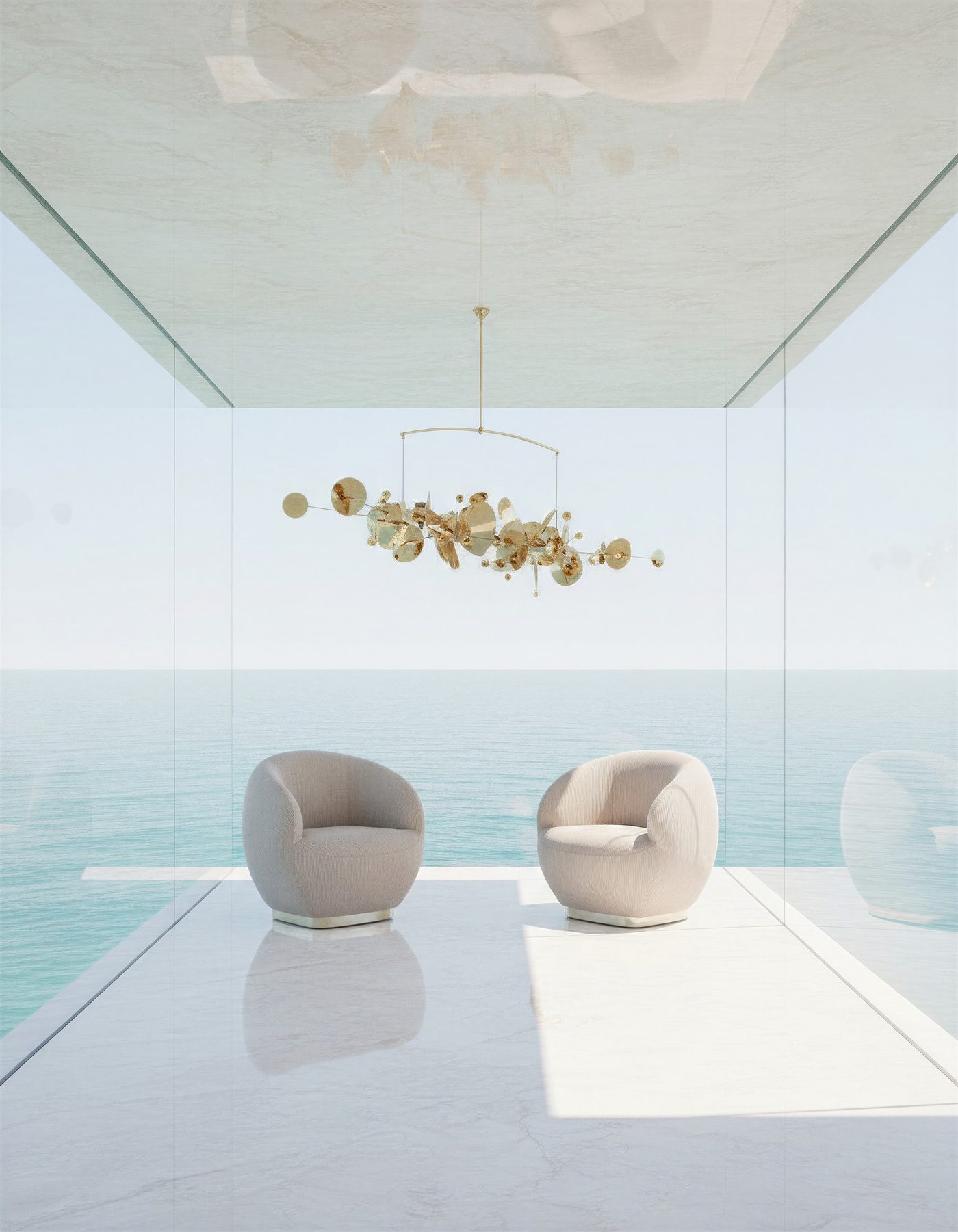 A pale minimal room open to the sea, two rounded armchairs under a gilded mobile